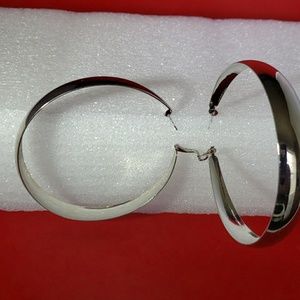 Brand new never worn large silver hpop earrings